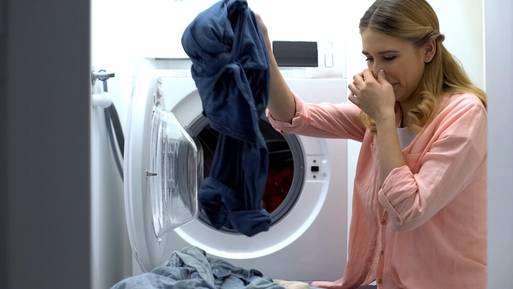 laundry smells bad after washing the machine