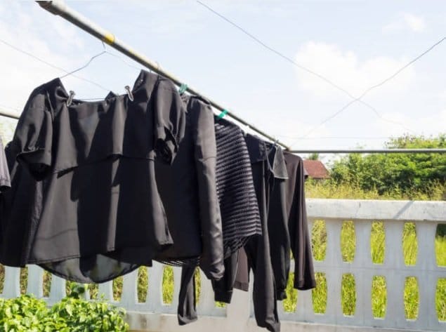 black linen clothes hung drying