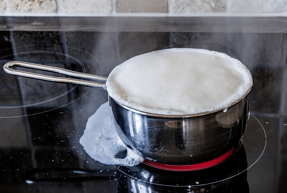 curdled milk overflows glass ceramic