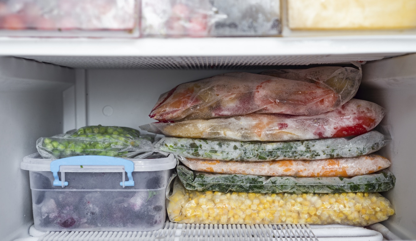 Frozen vegetables and fruits frozen foods well organized in the freezer