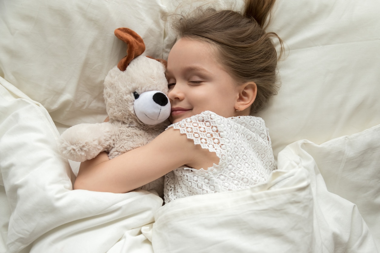 little girl sleeping in a deep sleep children's bed decoration bedtime