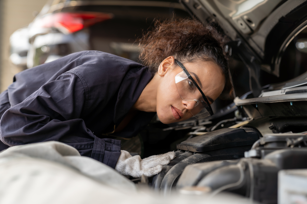 Mechanic working at garage safety glasses DIY works