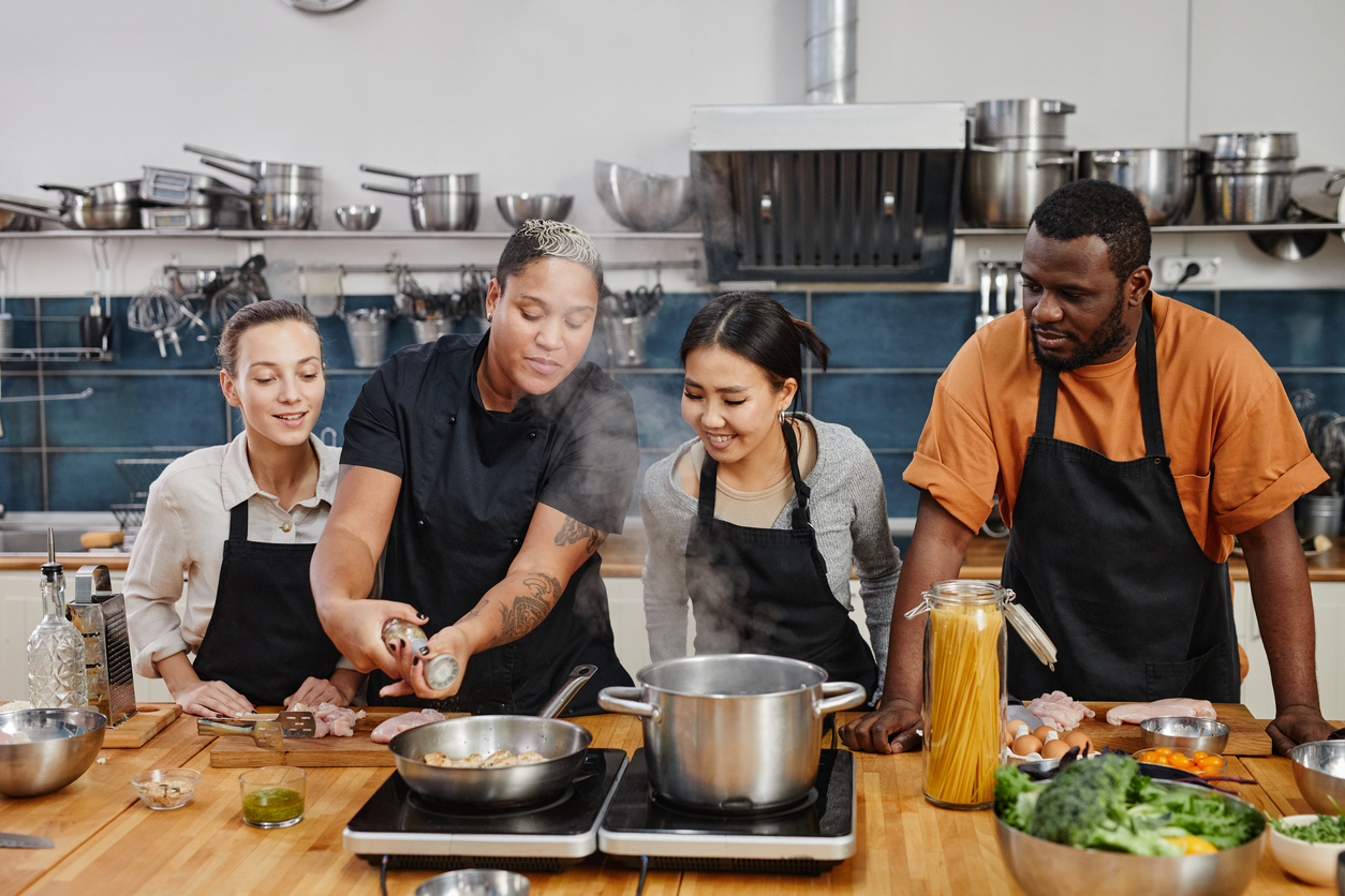 Chef teaching a cooking class on cooking meat