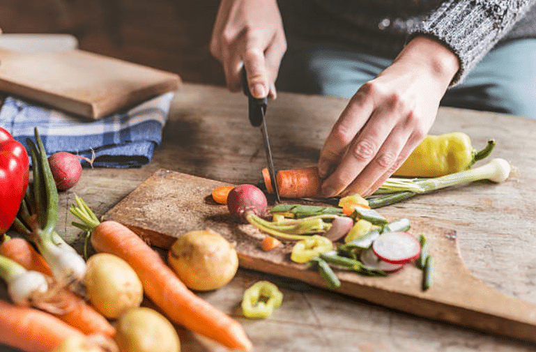 kitchen vegetables with skin cut out wooden board