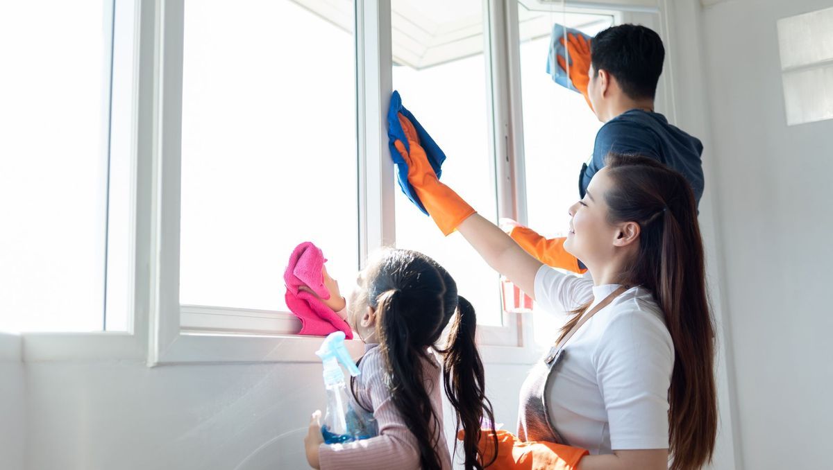 family cleaning participating in household chores