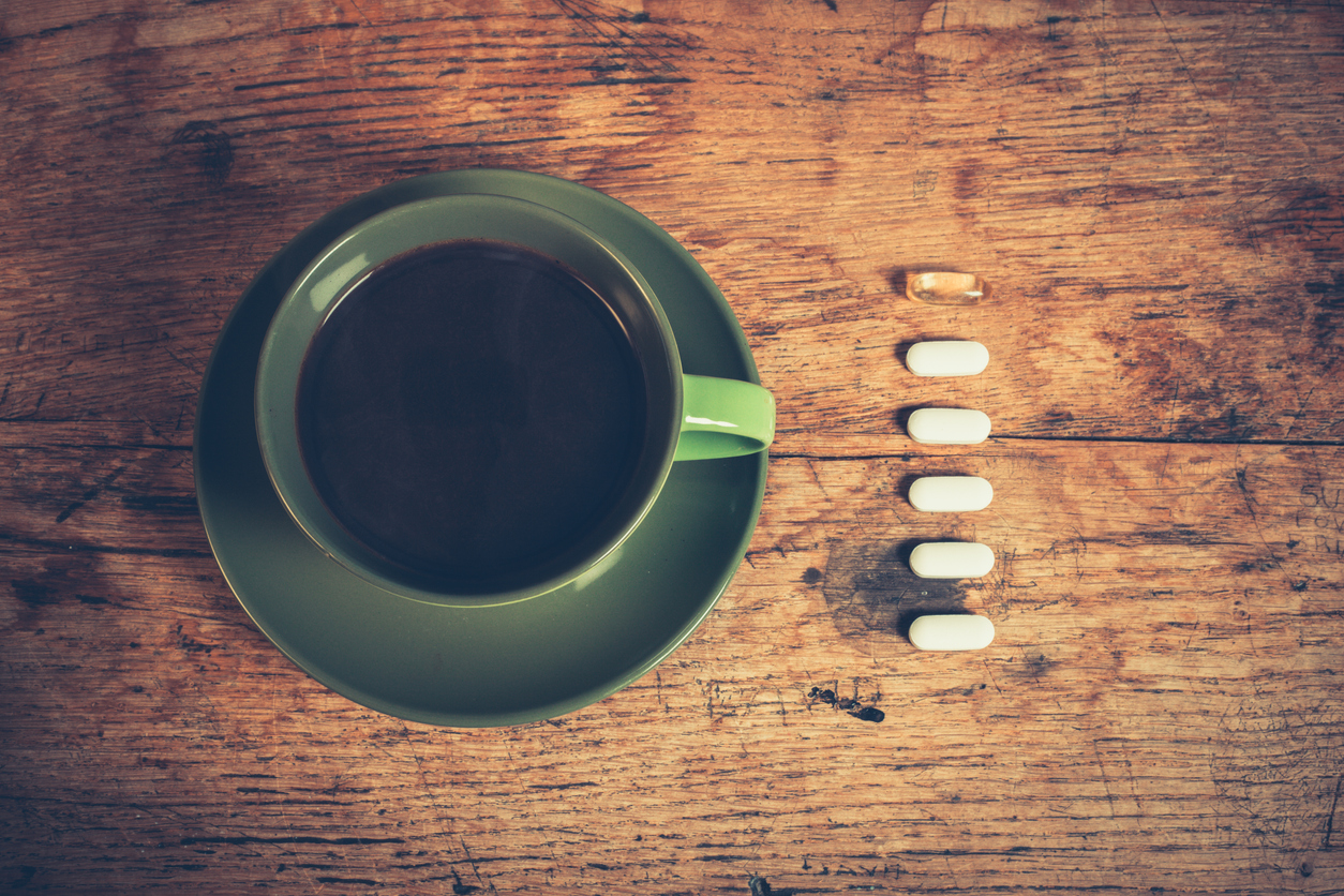 coffee and taking medicine pills medical treatment health