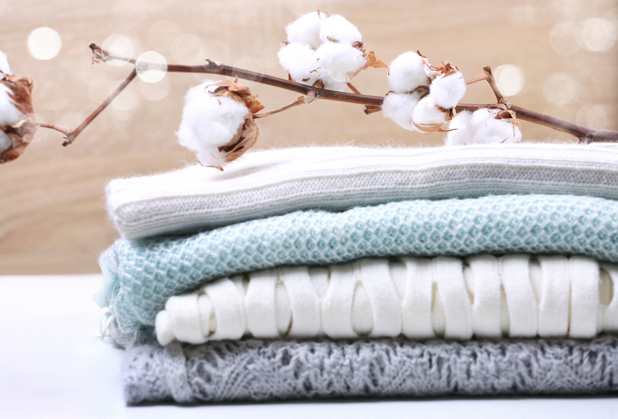 Cotton-flower-knitted-clothes-pile-of-wool-sweaters