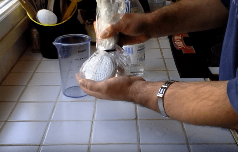 remove limescale from a shower head